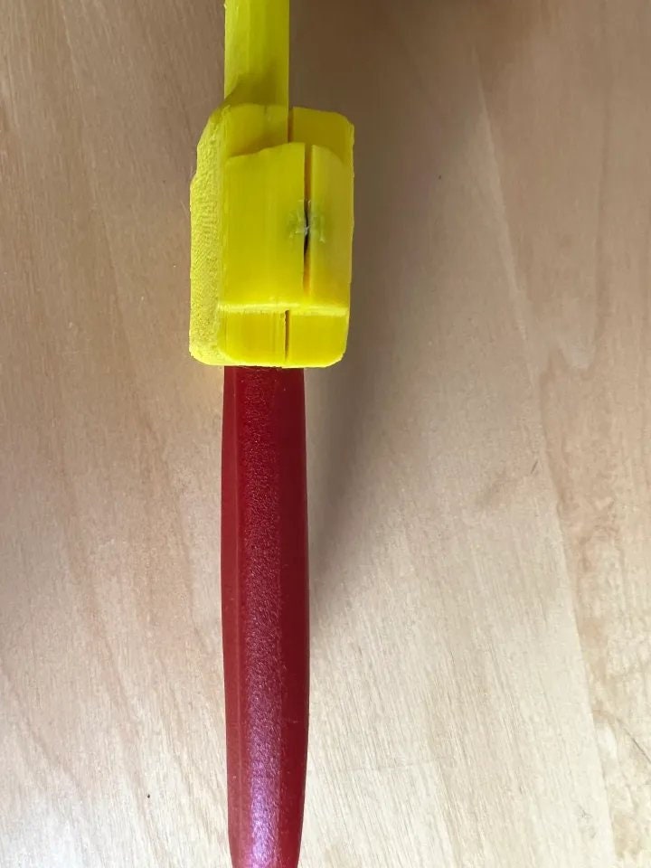 a toothbrush and a toothpaste on a wooden surface