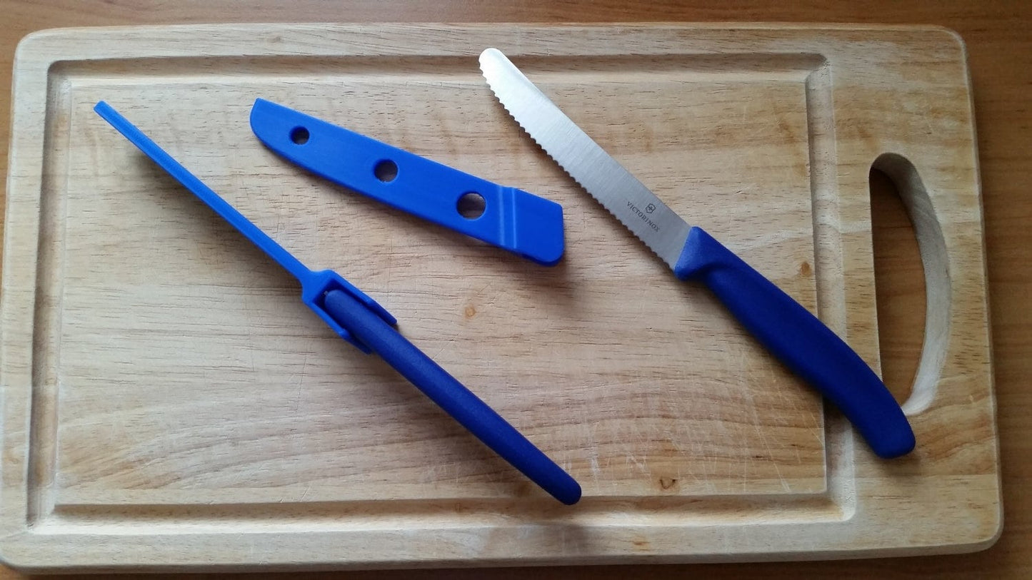 a cutting board with a knife and a knife sharpener on it