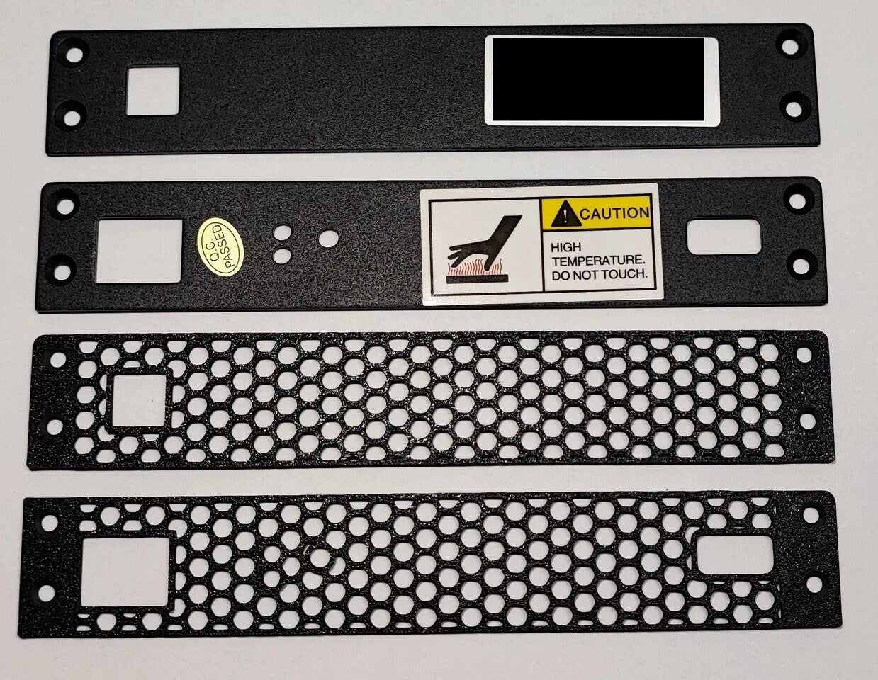 a set of three metal plates with labels on them