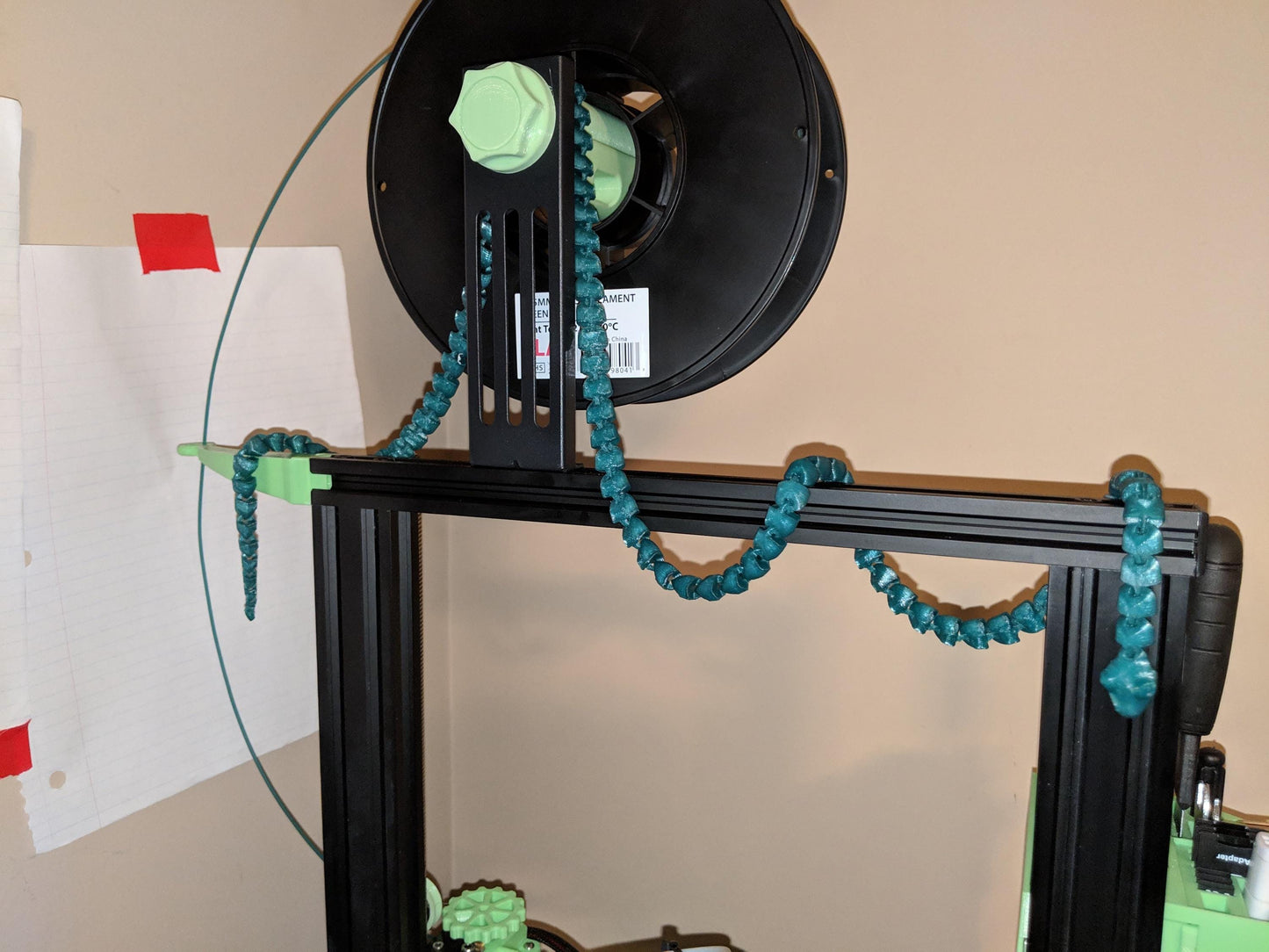 a picture of a clock with a string of beads on it