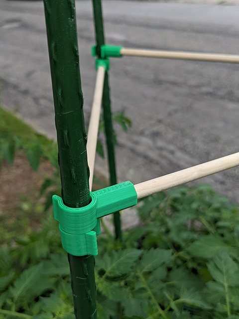 a close up of a pole with a green handle