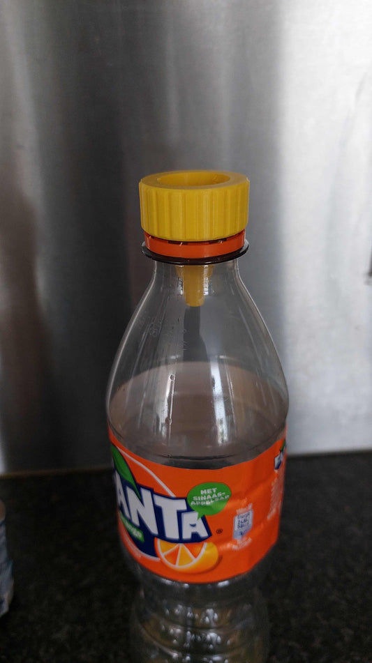 a bottle of orange juice sitting on top of a counter