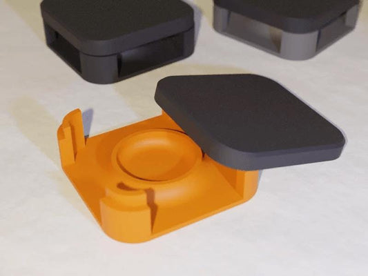 a couple of black and orange objects on a table