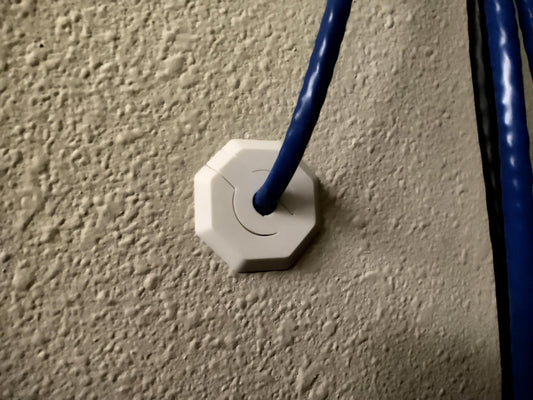 a close up of a blue and white electrical outlet