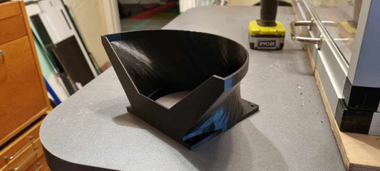 a black bowl sitting on top of a counter