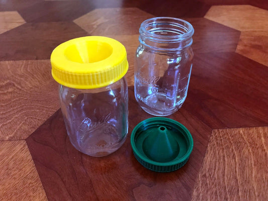 a couple of jars sitting on top of a wooden table