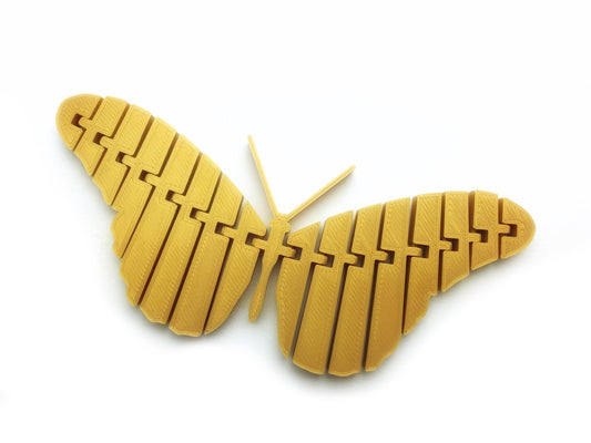 a close up of a yellow butterfly on a white background